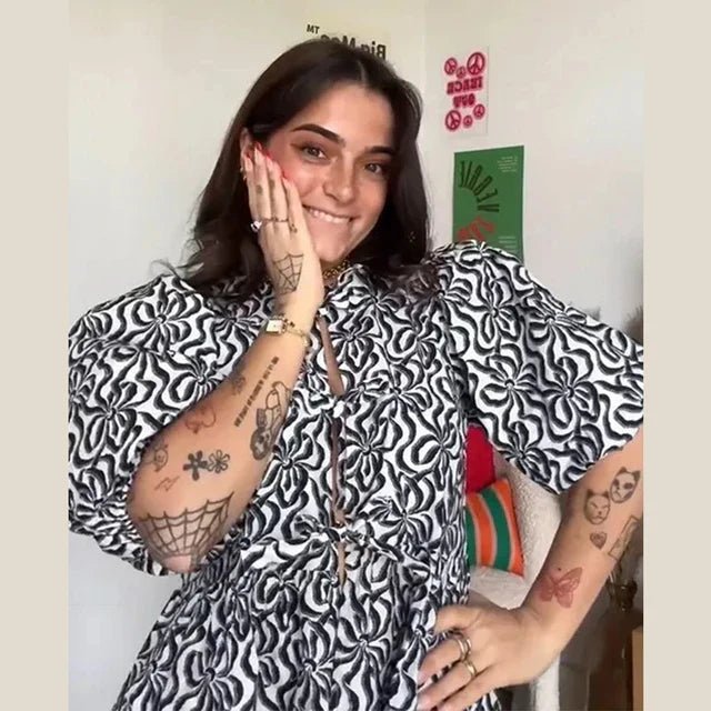 Bluse mit Leopardenmuster, Puffärmel und Schleifenakzent - Livezo